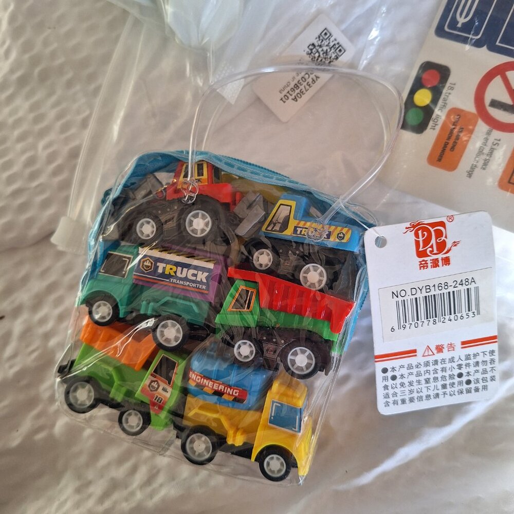 mini cars, signs with stickers and roadway